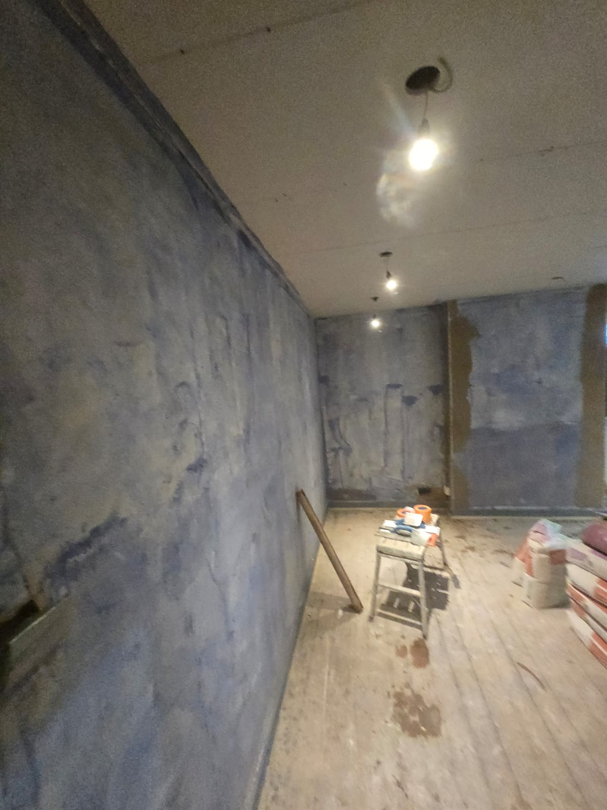 Room with freshly plastered walls drying